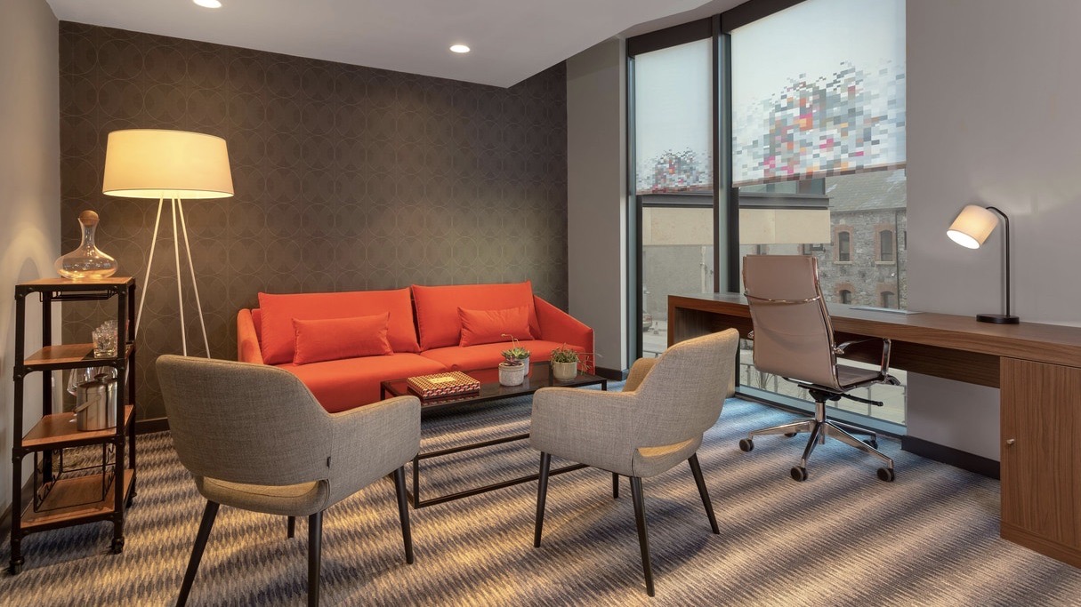 Aloft elegant seating area of design hotels in Dublin  bedroom